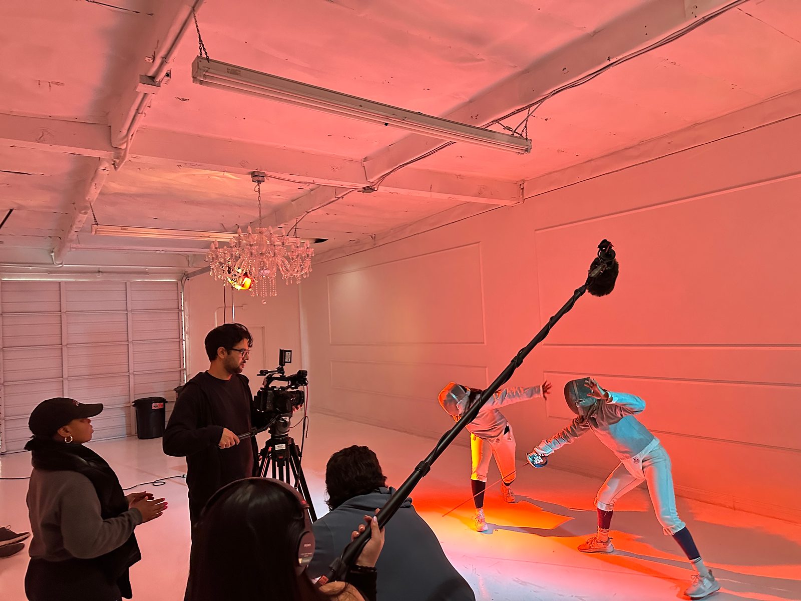 Rishi Kara on set, filming a fencing scene